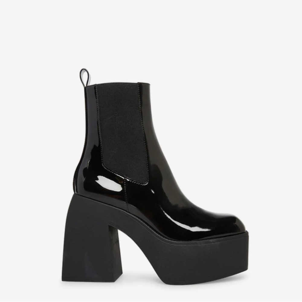 Brand new in box. Size 8.5. Square toe platform Chelsea boot.